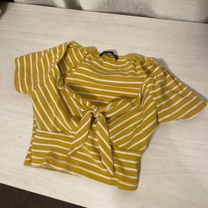 very cropped yellow t-shirt